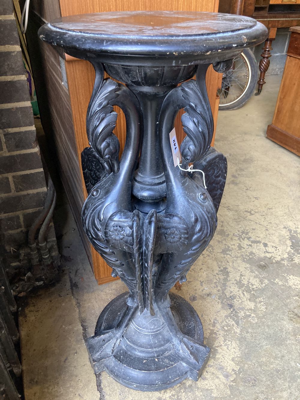 A Victorian ebonised carved wood lamp table in the form of three monopodiae stylised birds, 38cm diameter, height 94cm